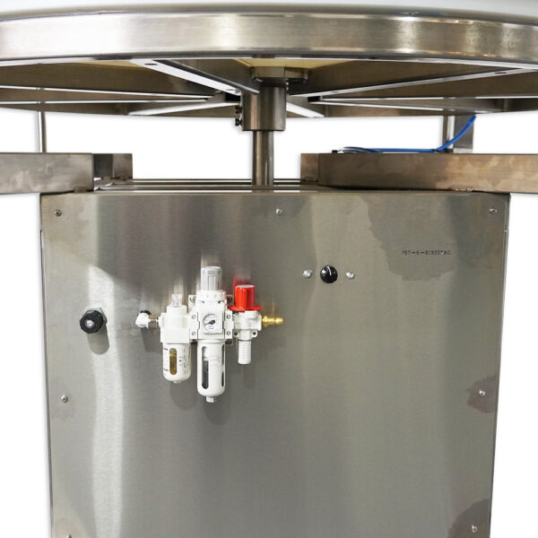 Pneumatic sorting table used for manufacturing by Packserv, featuring a stainless steel surface and adjustable guide rails.