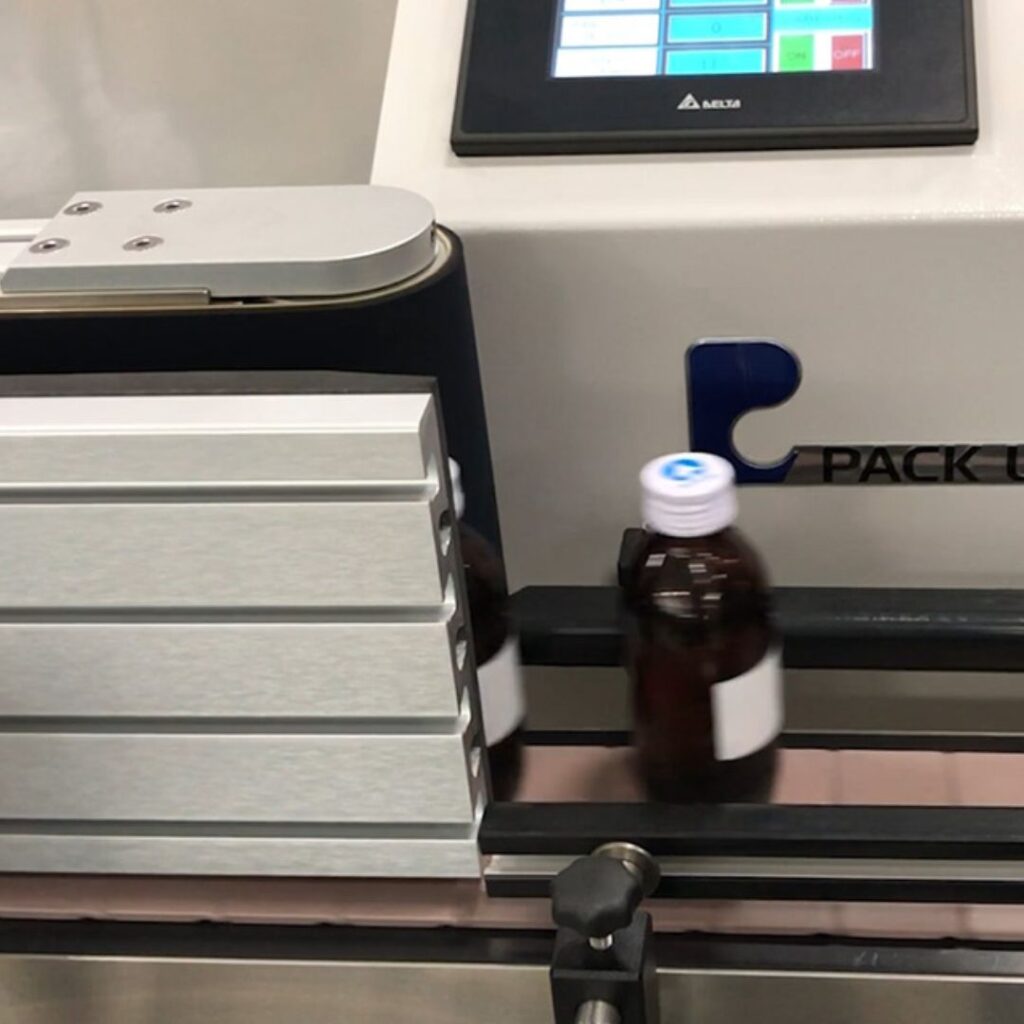 Craft beer labelling process showcasing precision and quality in brewing operations.