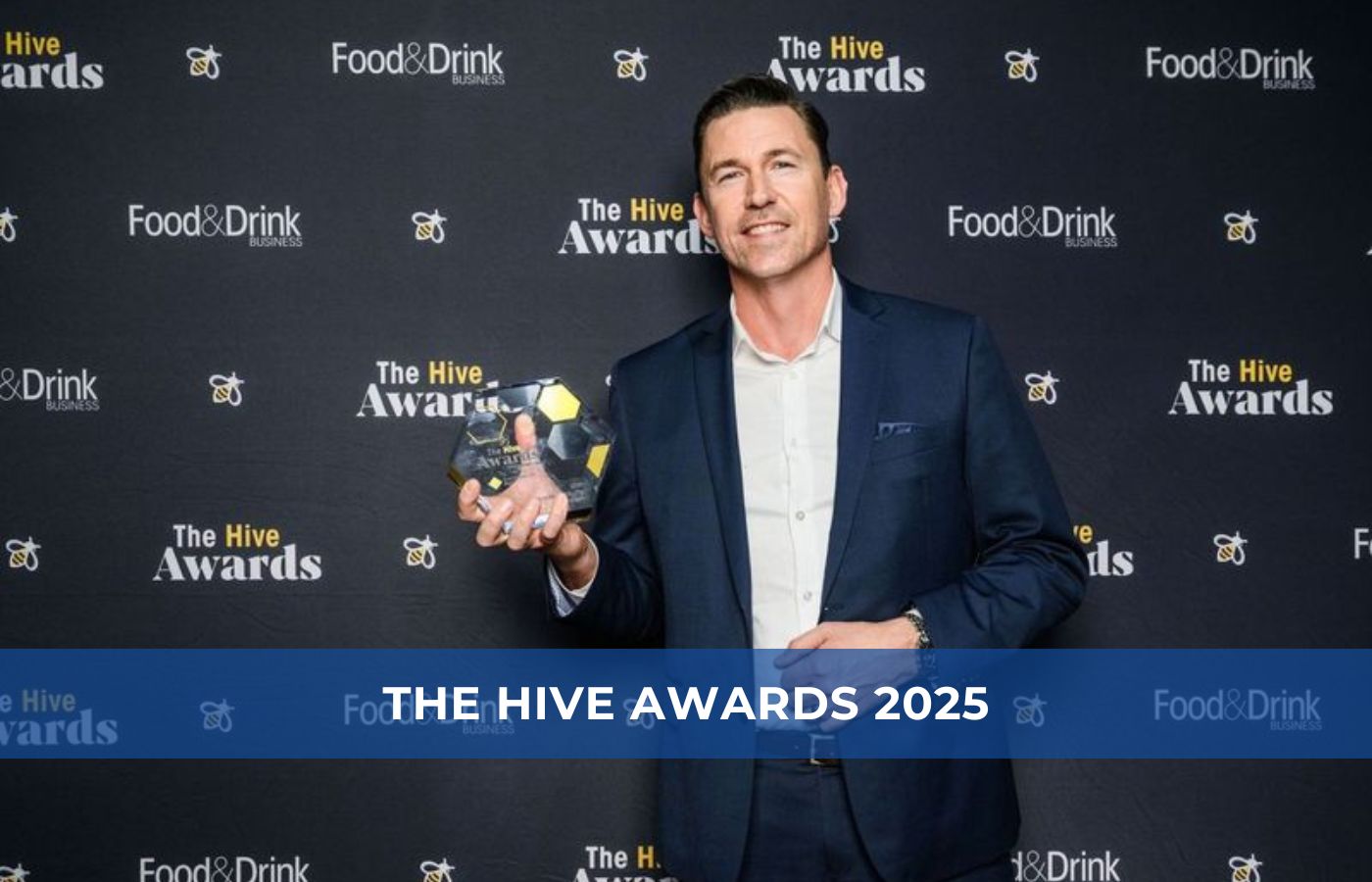 Nathan Wardell wins The Hive Award 2025, holding a framed certificate at a Packserv Australia event.